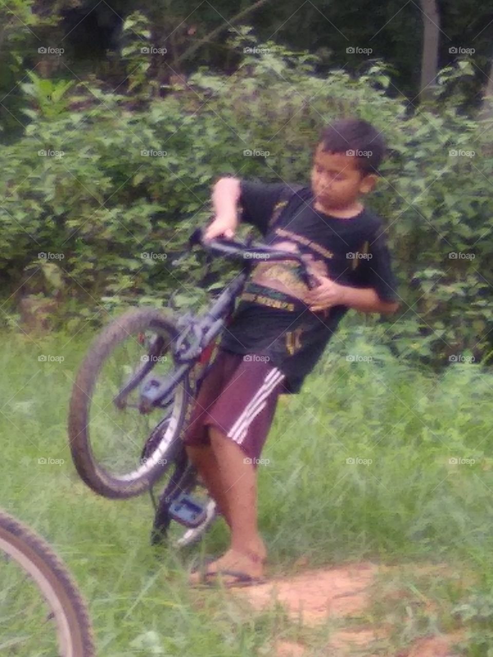 The village boy is happy to play happily