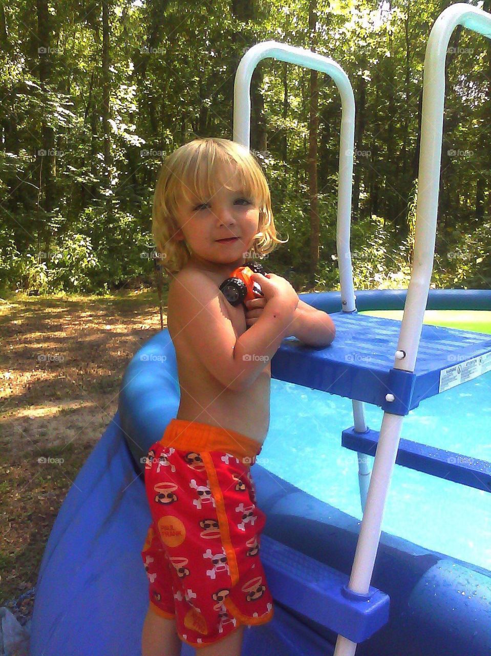 Portrait of girl with ground swimming pool