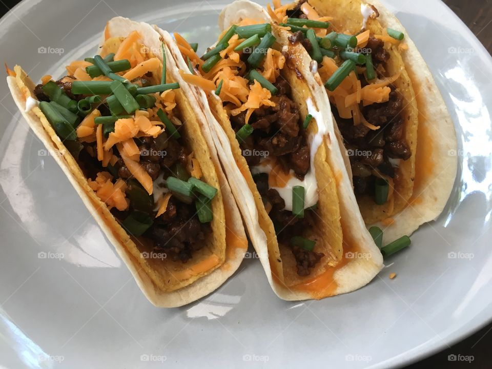 Mexican tacos, beef, peppers, onions, mushrooms, green onions, sour cream and secret taco sauce in a soft and hard shell - this is a fun meal
