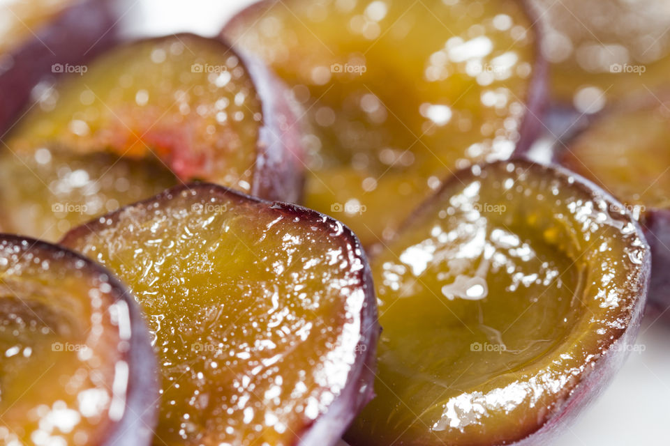 close up of slice of juicy delicious ripe plum