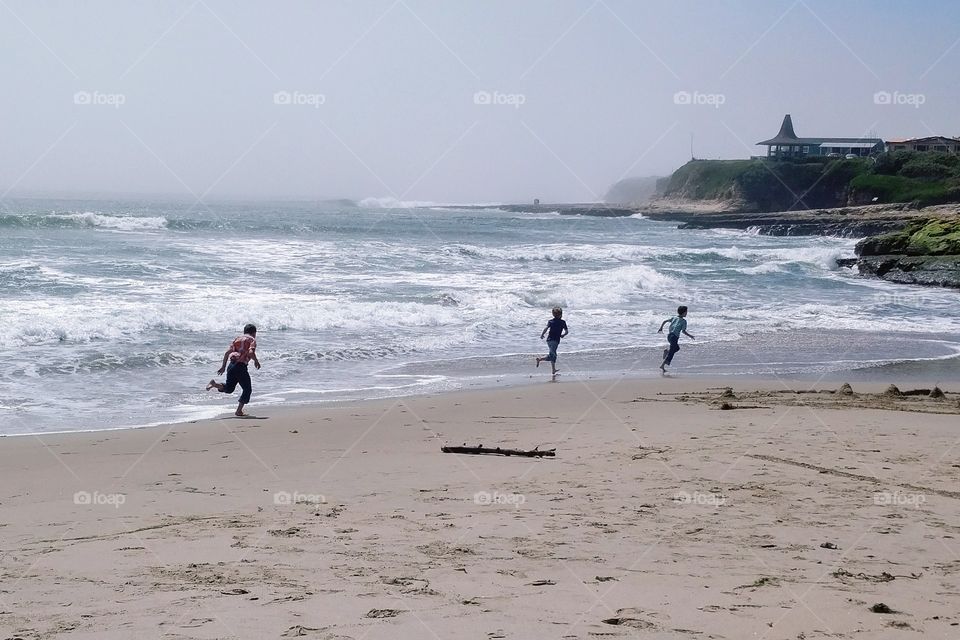 Young Boys Running on a Beach