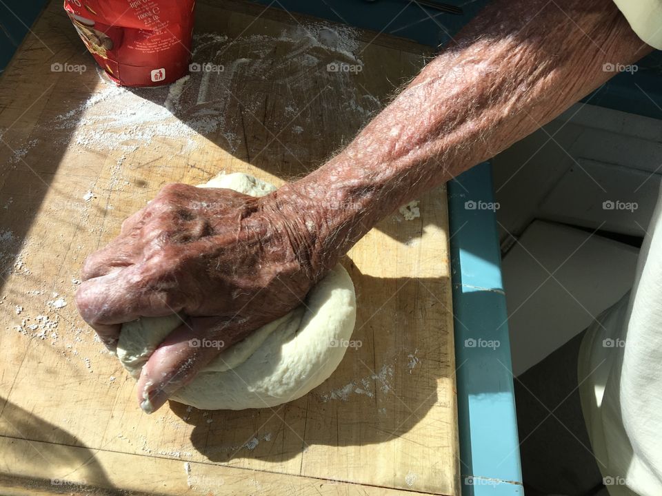 Hand kneading pizza dough