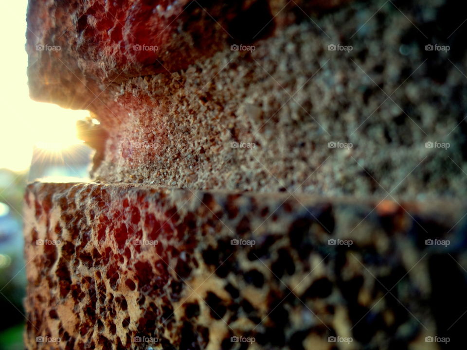 beautiful illuminating rays emerging from behind the wall