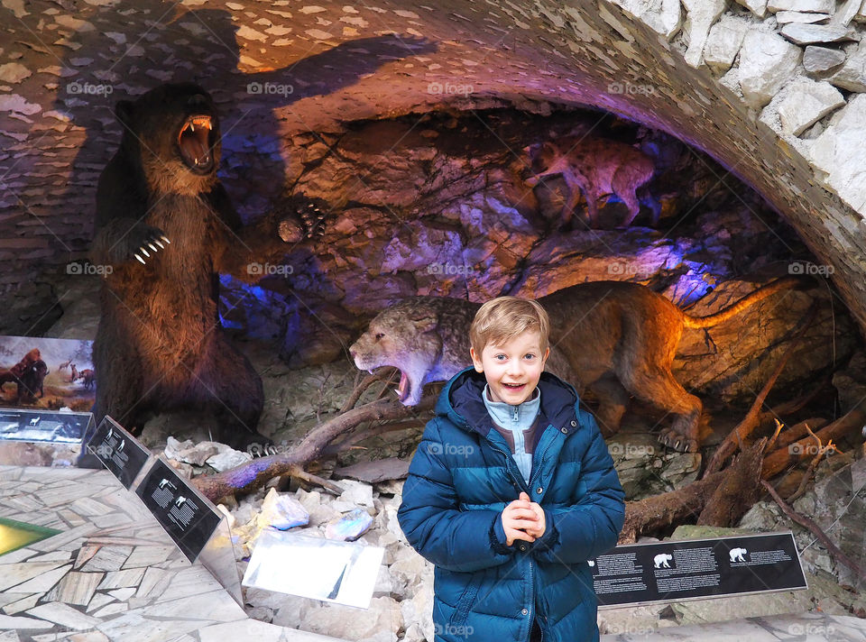 Portrait of boy standing at museum