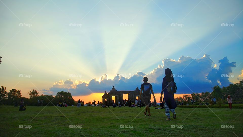 enjoying sunset view in ratu boko archaelogical site, near Jogjakarta, Indonesia