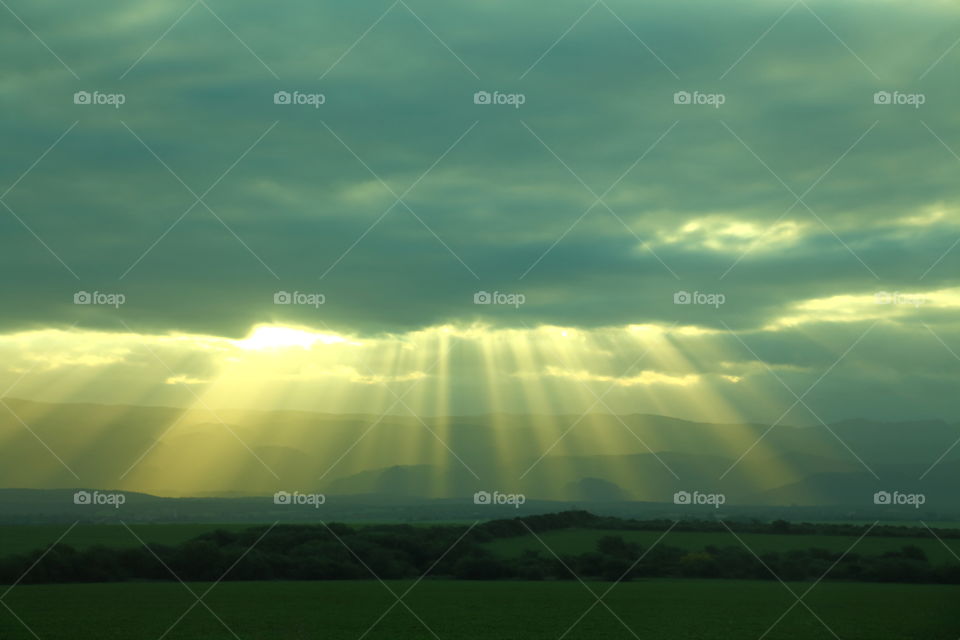 sunbath. sun rays at sunset