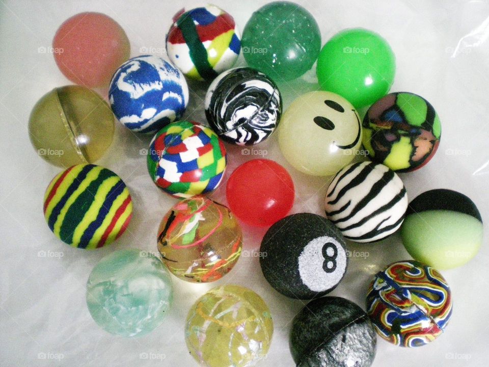 collection of colorful whimsical bouncy ball toys