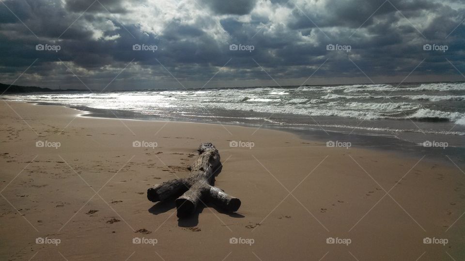 Sun peeks thru dark clouds