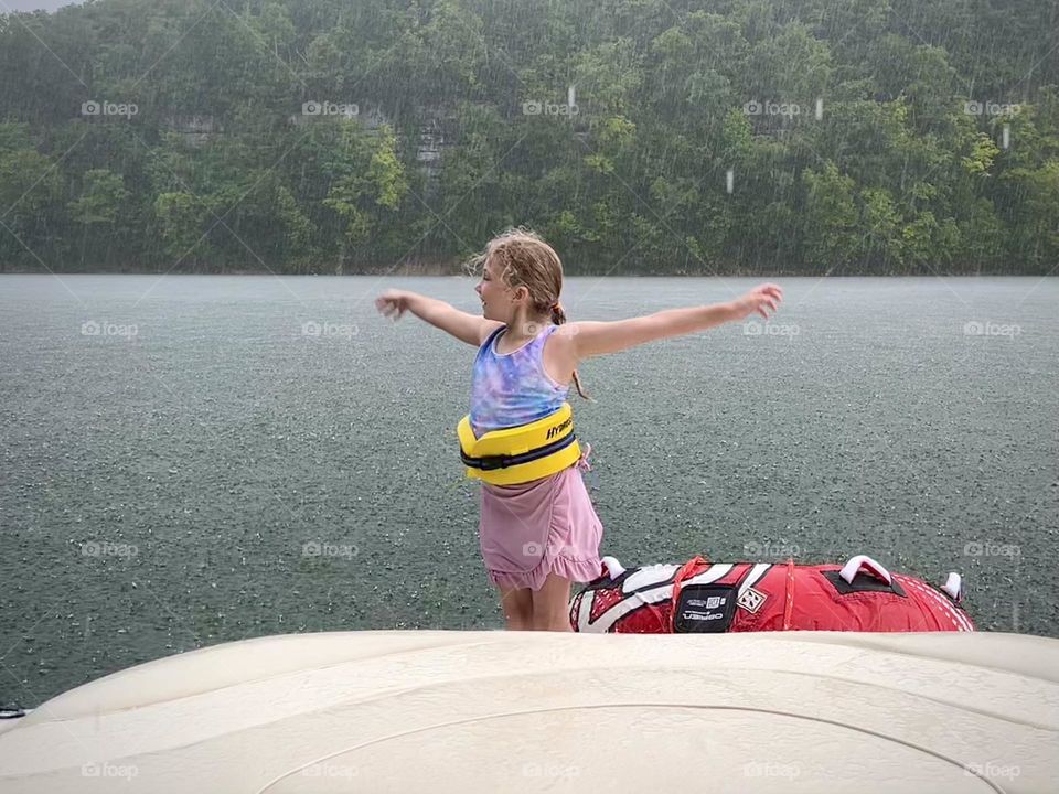 Dancing in the rain out on the lake
