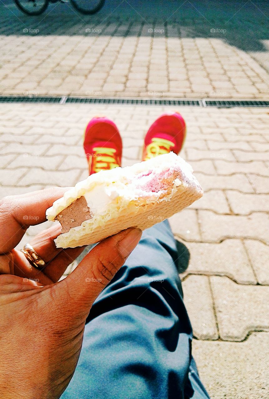 eating ice on the street in spring morning