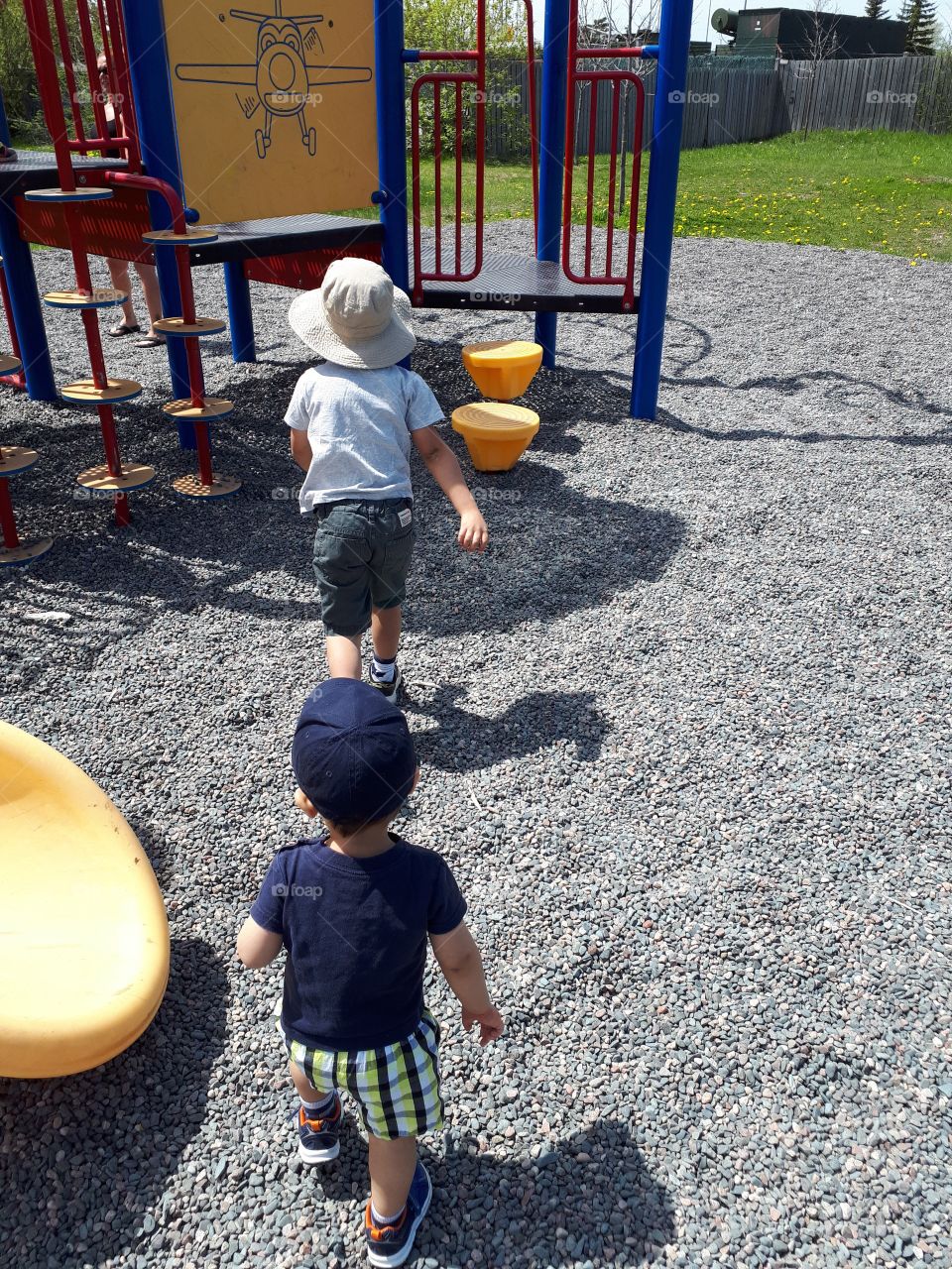 Boys playing on park equipment