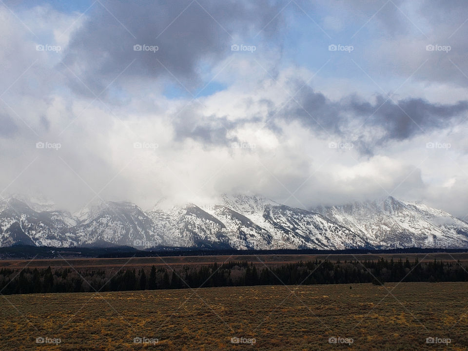 Grand Teton national Park mountains field clouds cloudy beautiful views scenic scenery travel traveling camping hiking