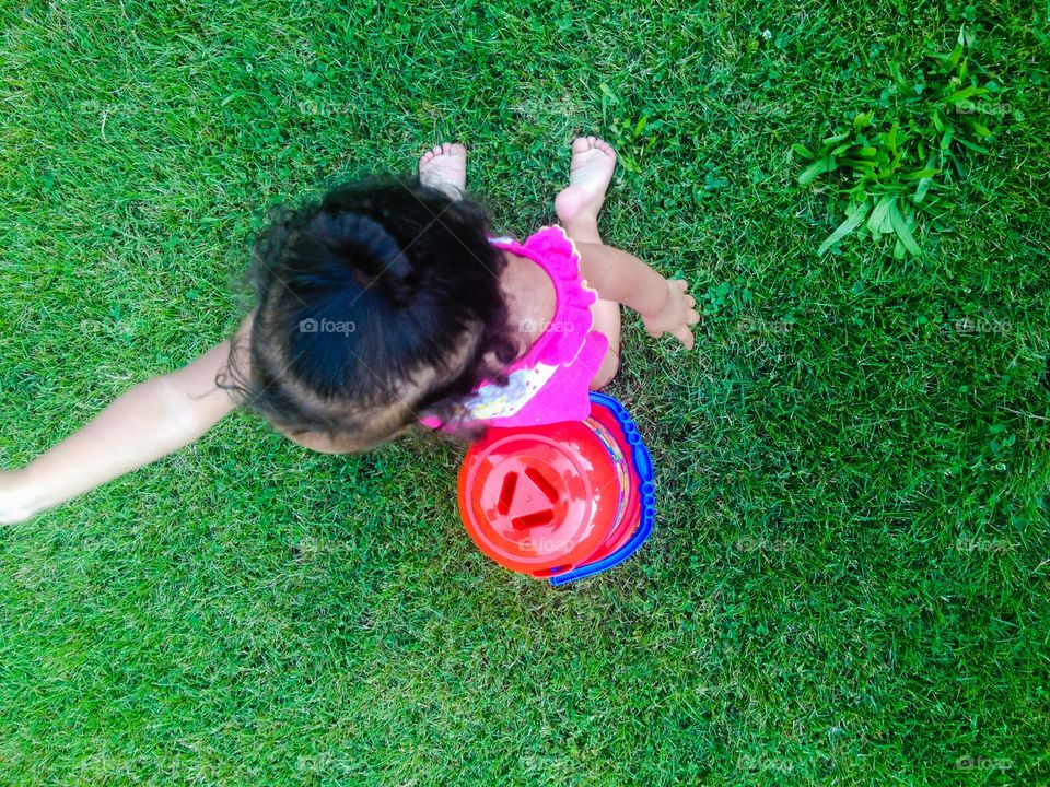Playtime. A little baby playing outside
