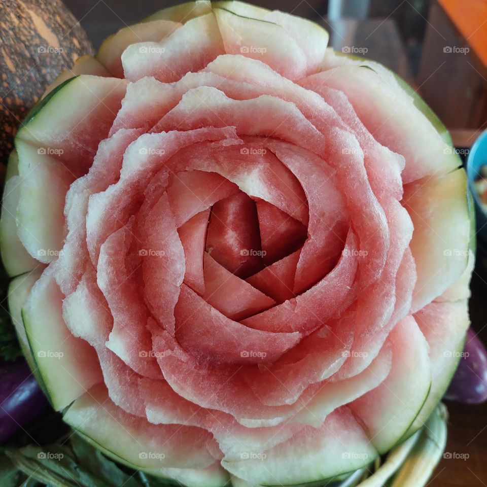 watermelon carved in the shape of a rose