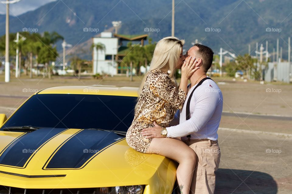 couple in love in a Chevrolet Camaro