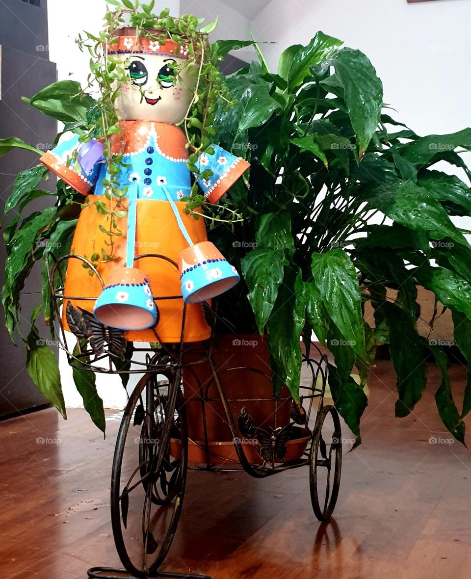 flower doll riding bicycle