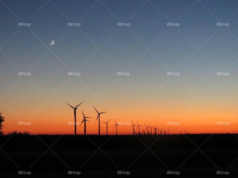 sunset over windmills