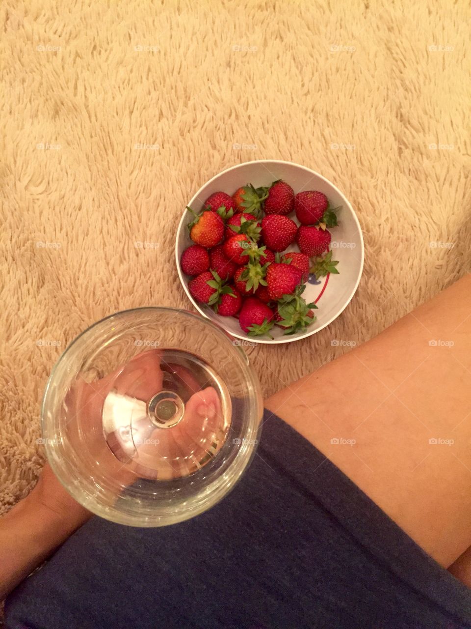 White wine and strawberries in a plate 