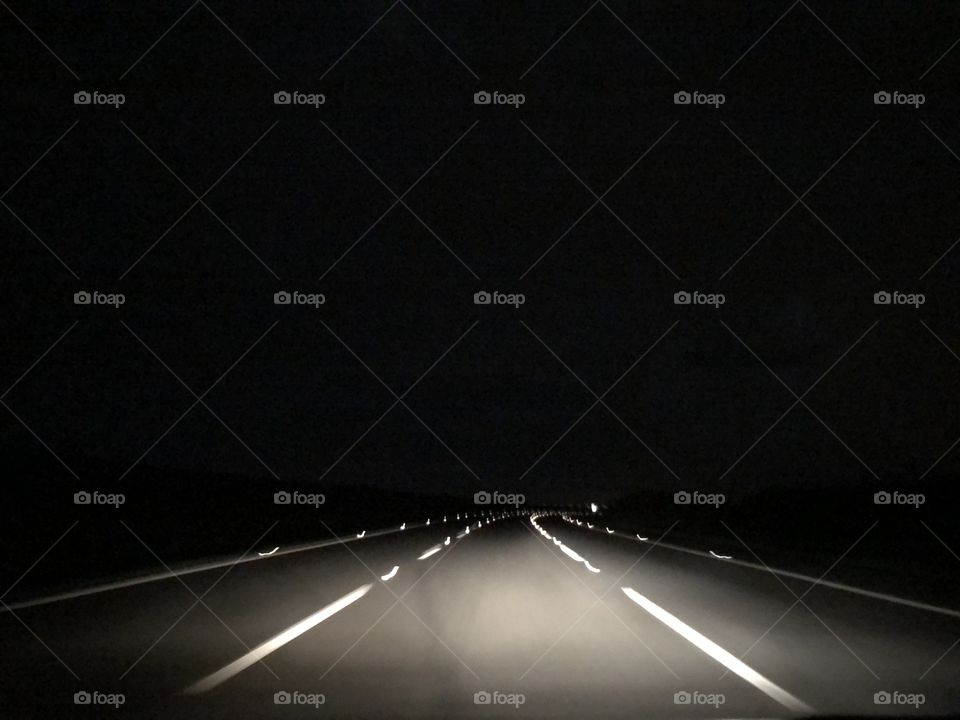 On the road... Returning home late at night, driving on a empty highway... Only me, my car and the road. And the darkness.