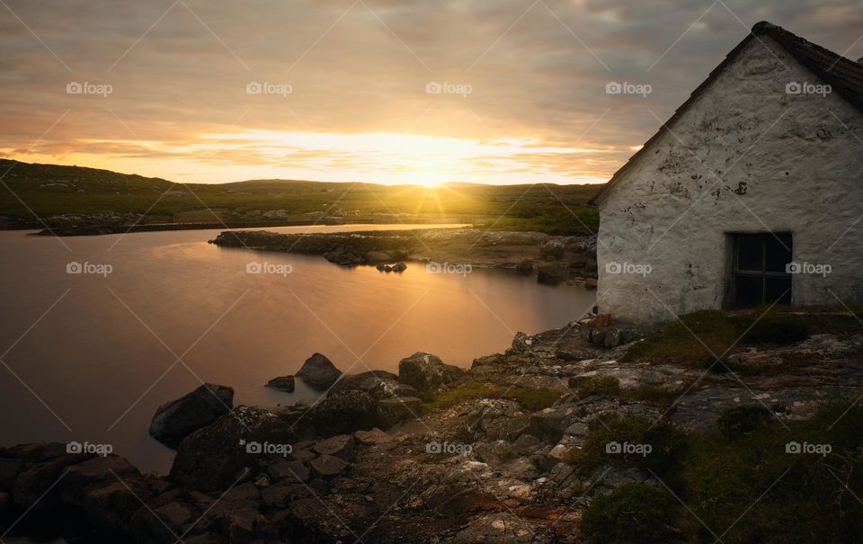 Magical sunrise at fisherman's hut by the lake in Screebe ,connemara national Park ,county Galway ,Ireland