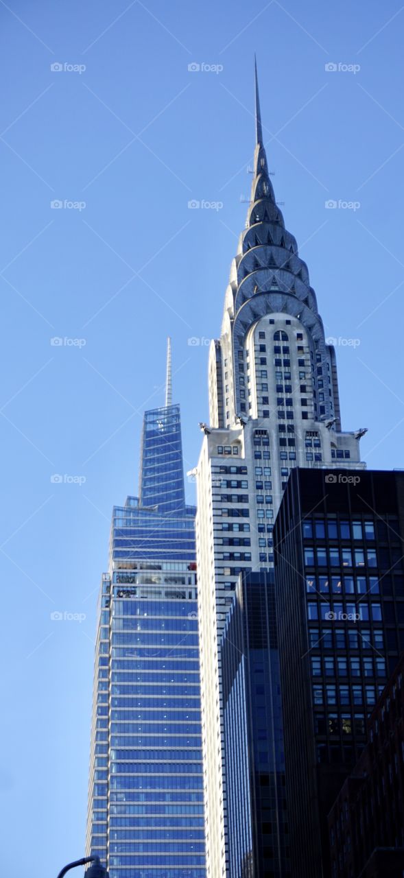 Architecture historic and new.  One Vanderbilt 2019 office tower rises next to the 1930 Art Deco style Chrysler tower. Both beautiful in the skyline.  