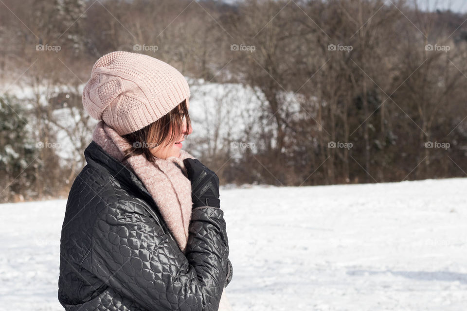 A woman enjoying a snowy winter day