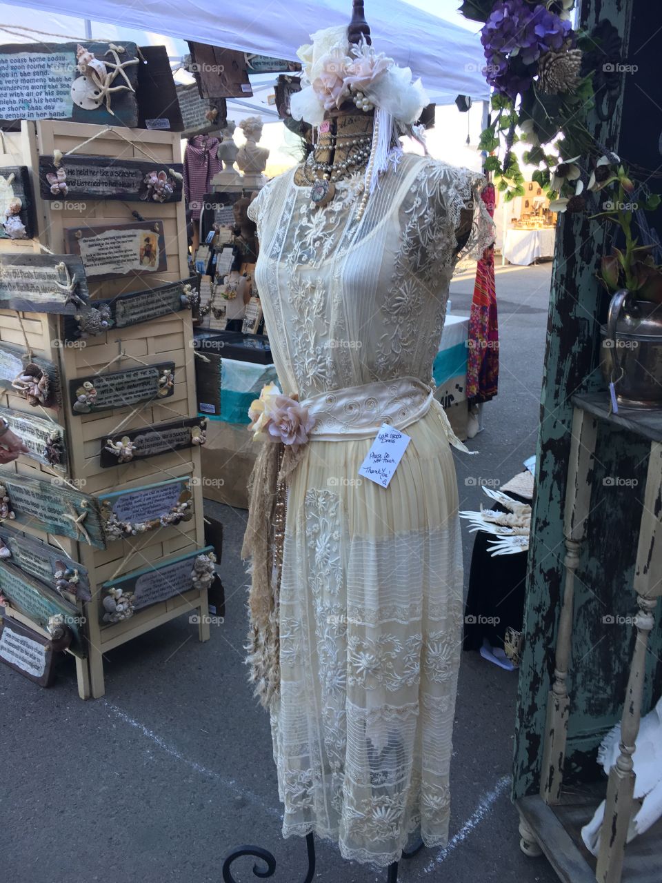 Scottsdale/Arizona, Circa August 2016, Vintage dress hangs on mannequin at Junk In The Trunk flee mart.  