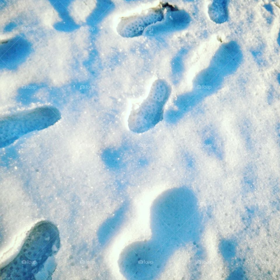 Foot steps on ice