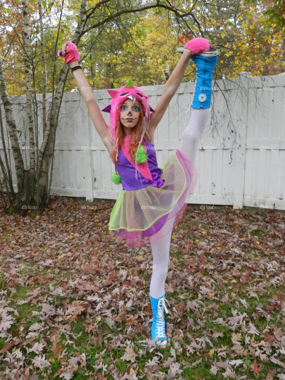 Girl dancing in autumn park