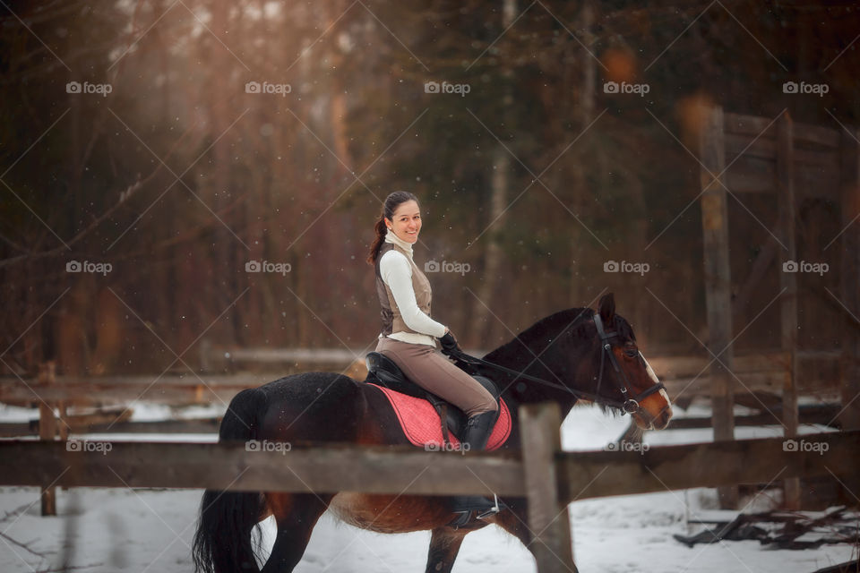 Young beautiful woman with horse outdoor portrait at spring day