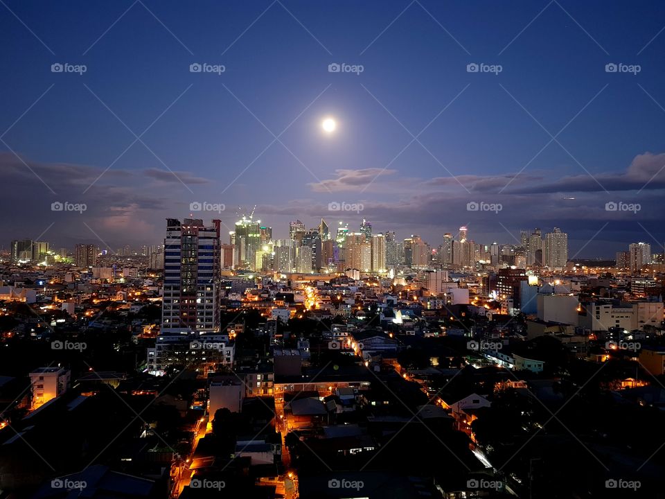 The moon over Makati City