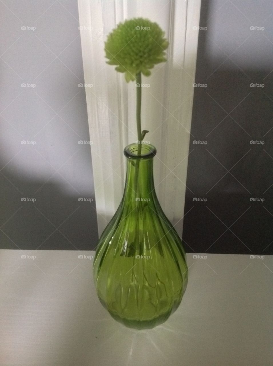 A green glass vase.