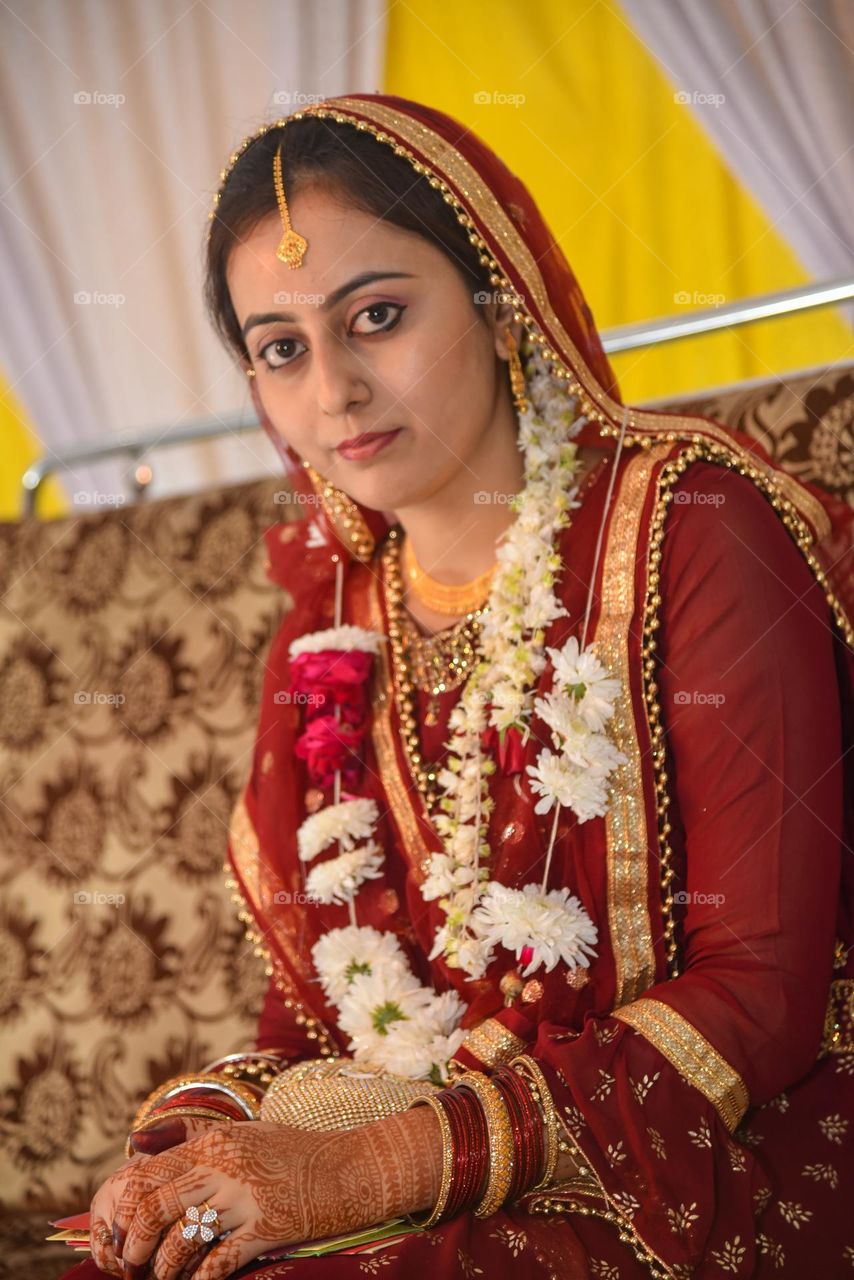 Portrait of a lady wearing heavy gold jewellery