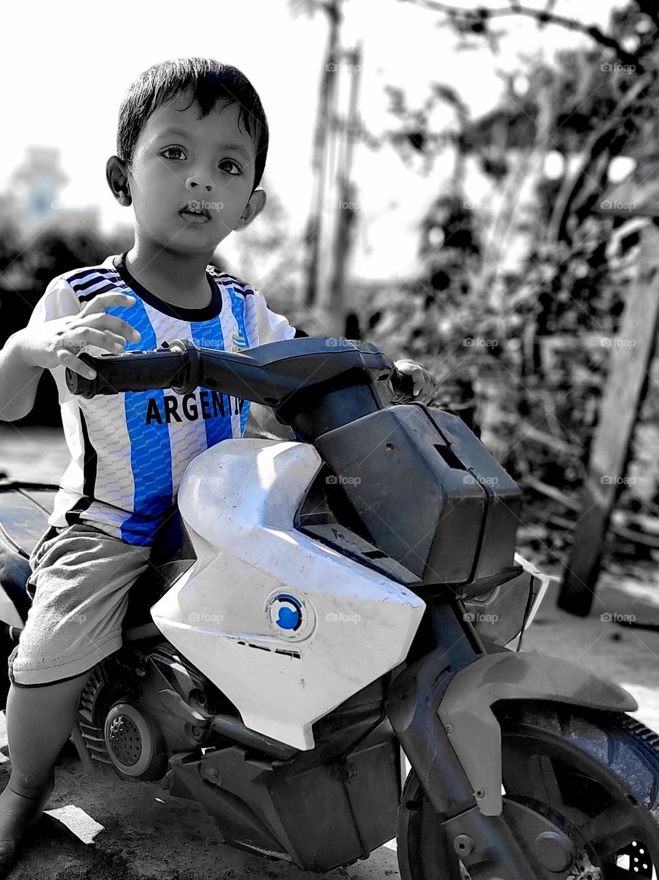 boy riding a Moto