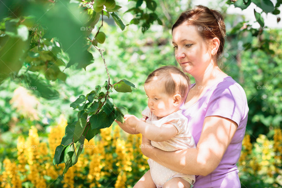 Mother with baby in the garden