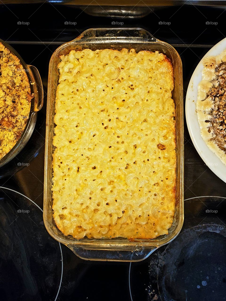 baked macaroni and cheese casserole in a glass rectangle dish