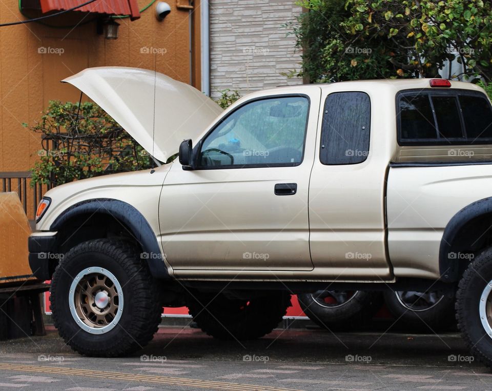pickup truck with hood open