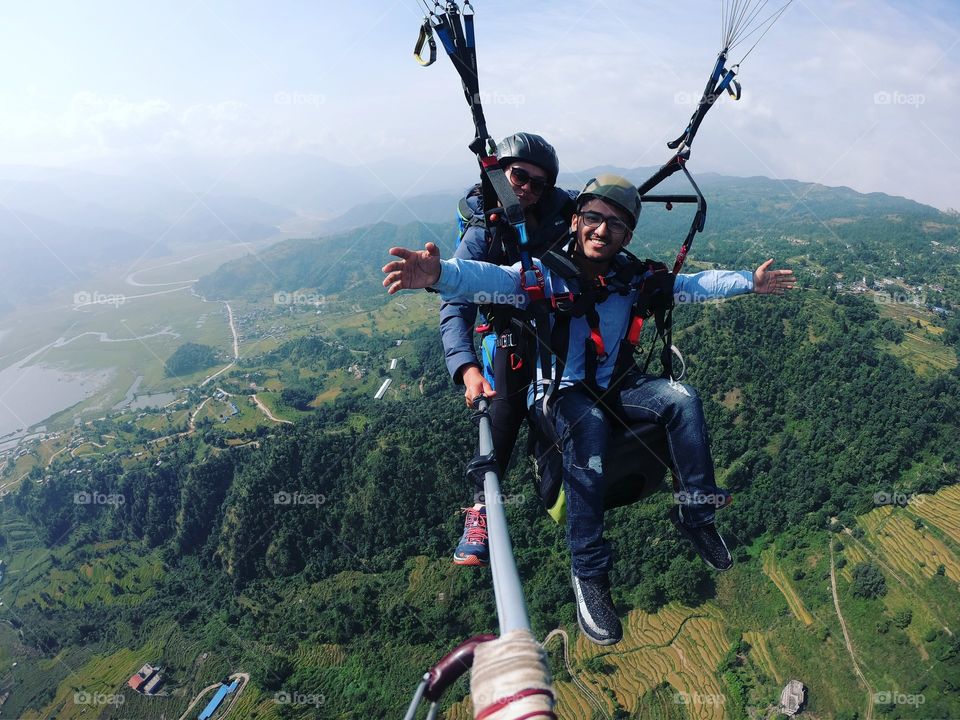 Paragliding over the city of Pokhara. Stunning view and cold air made me feel that I was alive.