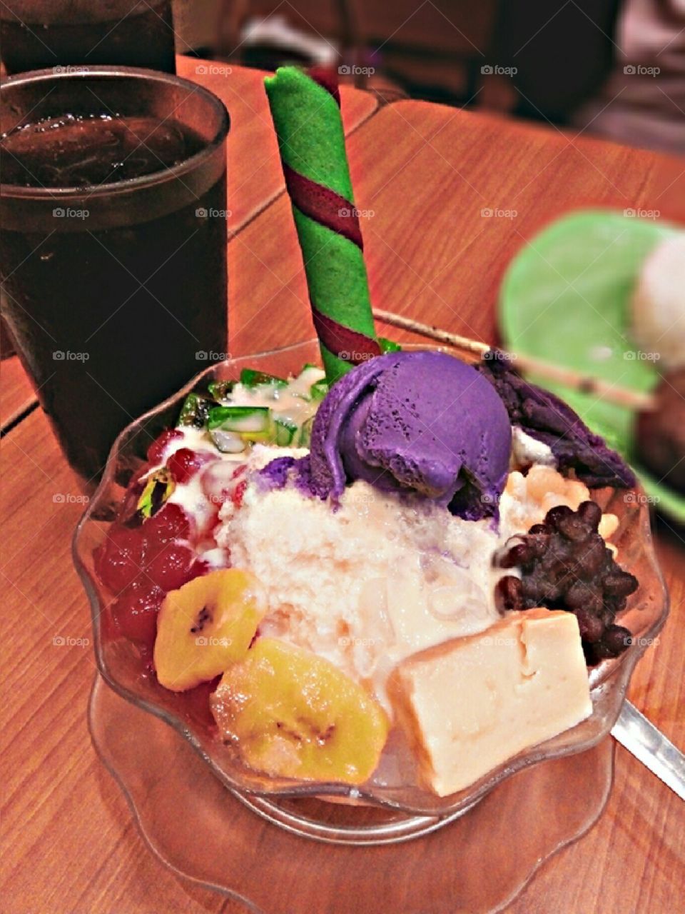 Haluhalo or Halo-halo is a popular Filipino dessert with a mixture of shaved ice and evaporated milk to which various ingredients are added, including boiled sweet beans, coconut, sago, gulaman, tubers, fruits, and yam ice cream.