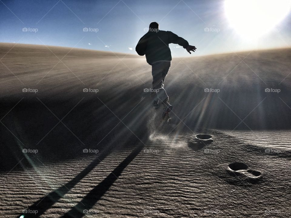 Running footprints in the sand