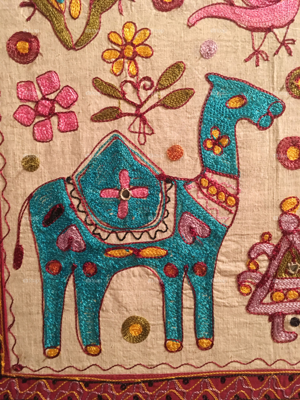 Tapestry embroidered with a camel