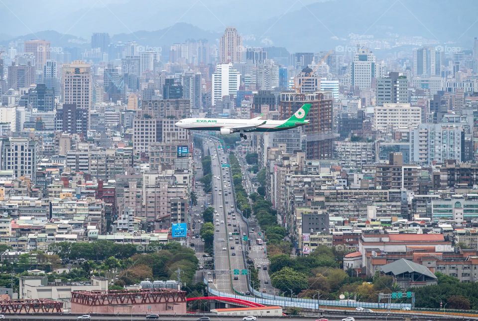 Airplane landing into city