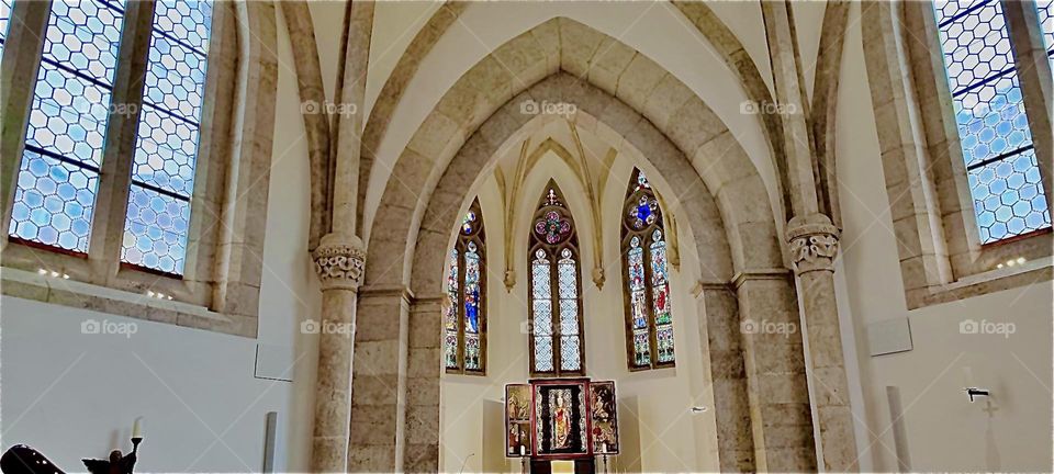 The beautiful gothic style windows and altar at the “St. Katharinenkirche” or “St. Katharine’s Church” in “Regensburg”, “Oberpfalz” in Germany. 2023. Hypnotic Productions