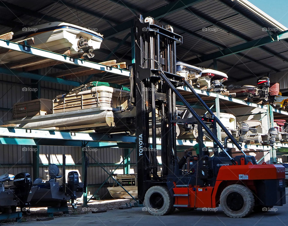 Toyota boat forklift moving boats from A to B