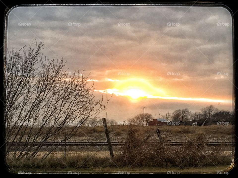 Sunset over red barn 