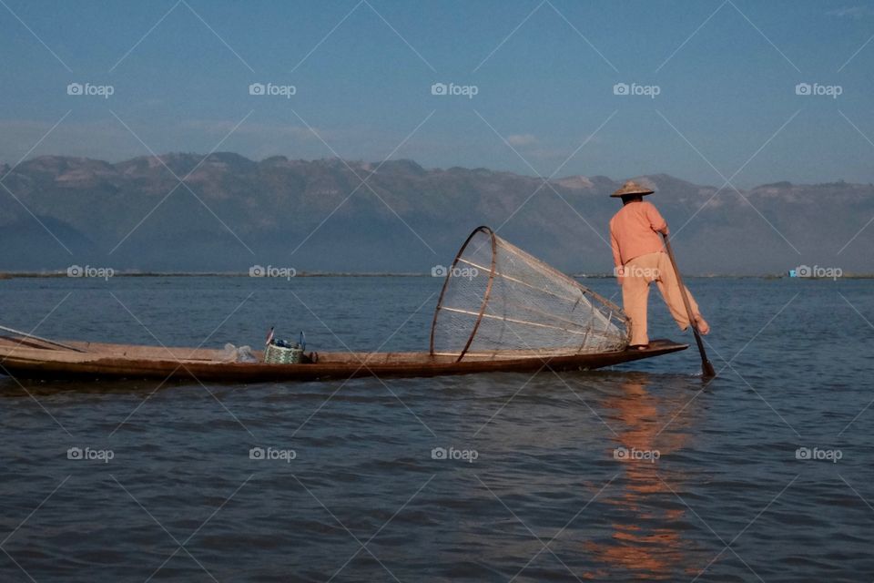 Pushing the boat with his leg