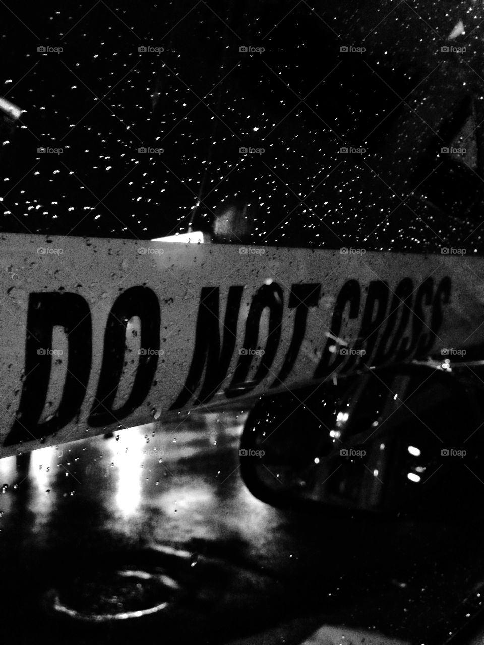 Rainy Crime Scene . Crime scene tape on a rainy night