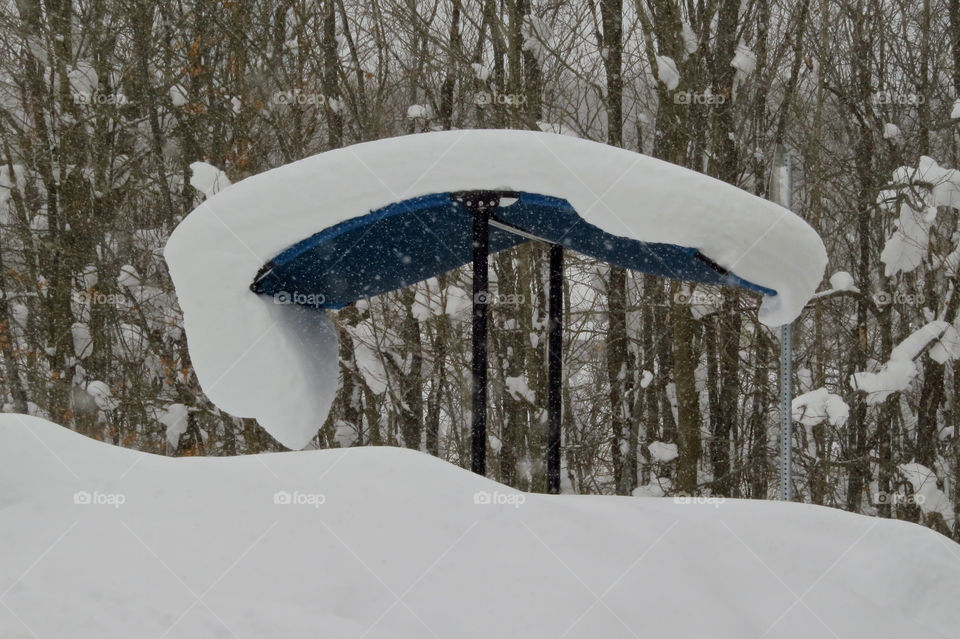 Heavy snow hanging over a roof