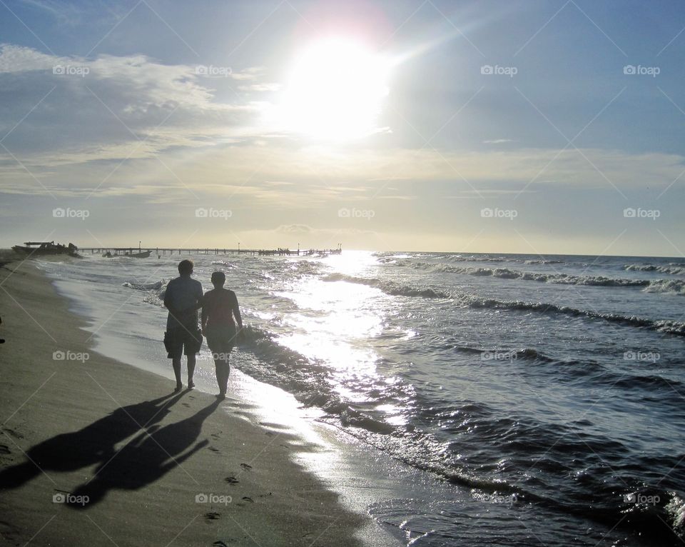 Couple Strolling on the Beach