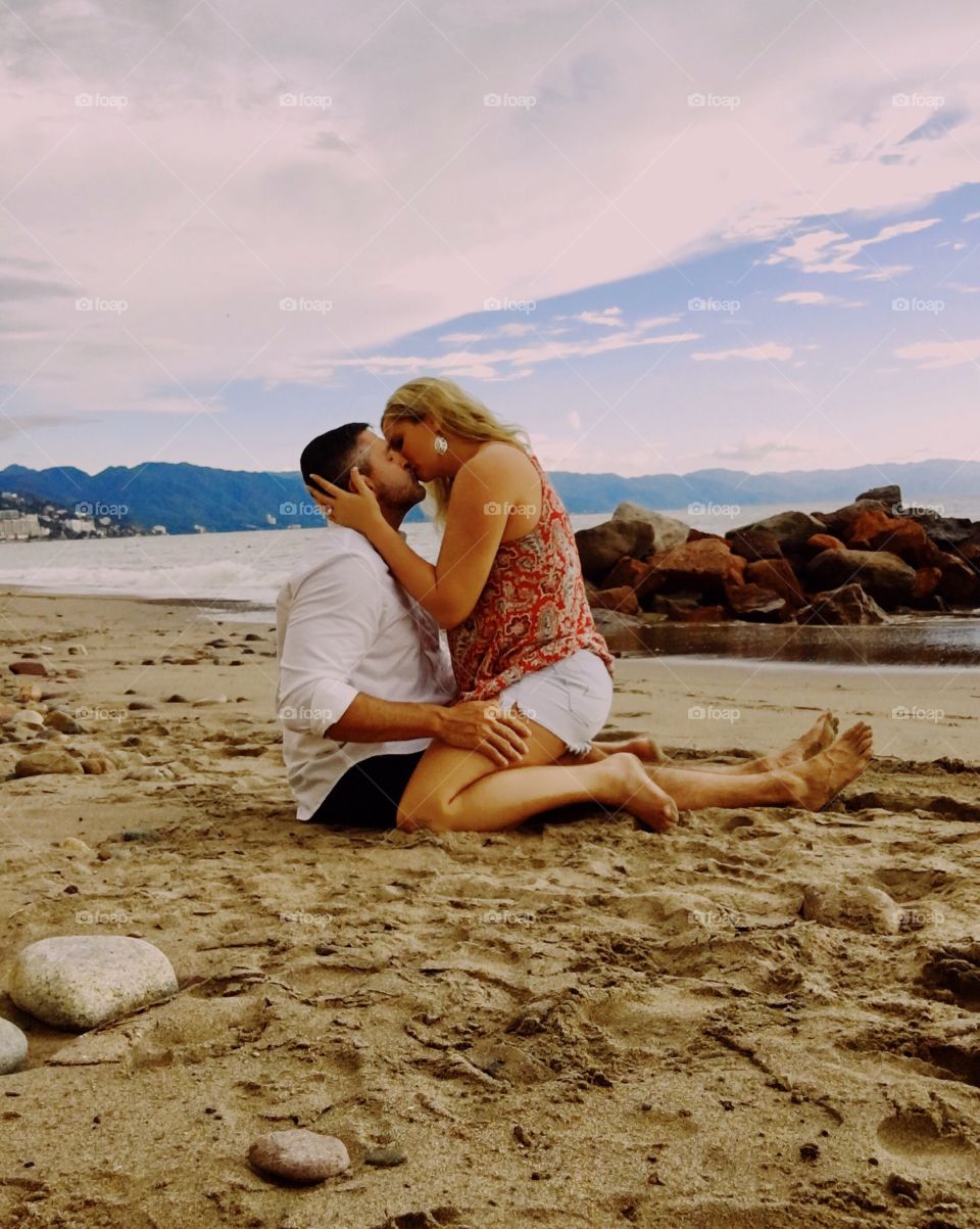 Passionate kiss on the beach
